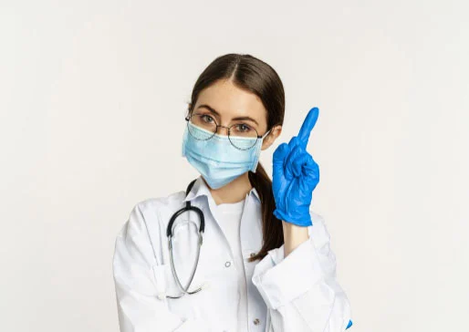 close up portrait female doctor glasses medical face mask gloves pointing finger up lin 1