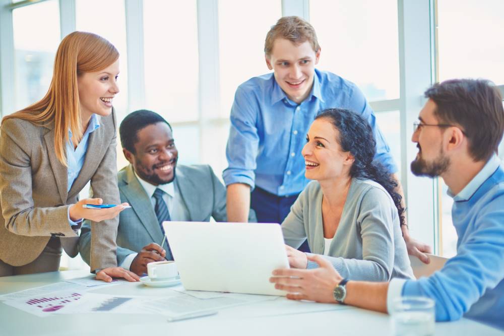 executives joking laughing office Medium